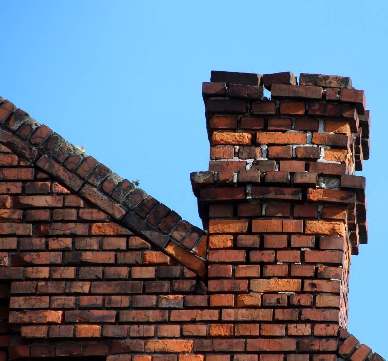 Signs Your Watauga Home Needs a Chimney Inspection Damaged chimney on an Watauga home showing cracks and missing mortar